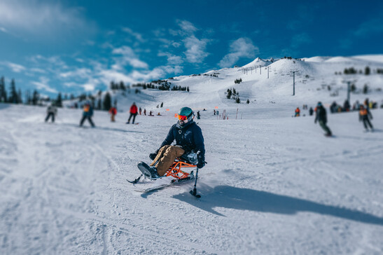 Adaptive athlete enjoying a winter day on the mountain
